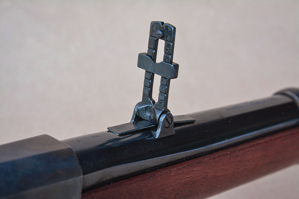 The rear sight is a standup ladder style.